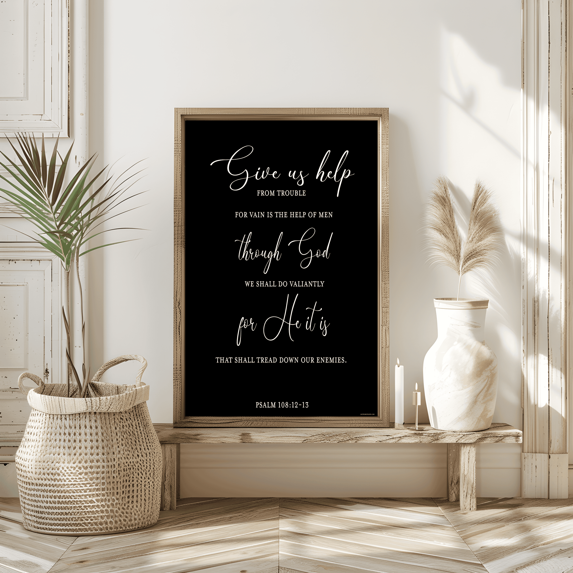 A framed Psalm 108:12-13 Art Print from Olive Grove Life displayed on a shelf.