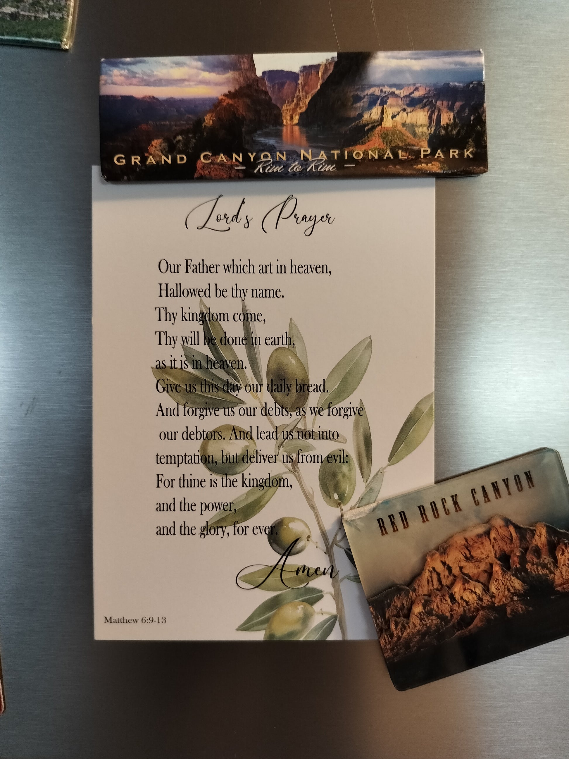 card with the Lord's Prayer on a metallic surface