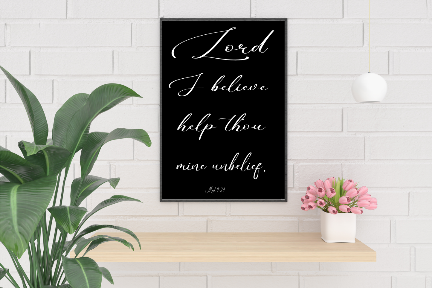 Mark 9:24 Wall Art hanging above a shelf holding a vase of pink tulips